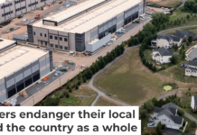 An Amazon data center sits next to a neighborhood in northern Virginia. Nathan Howard/Getty Images